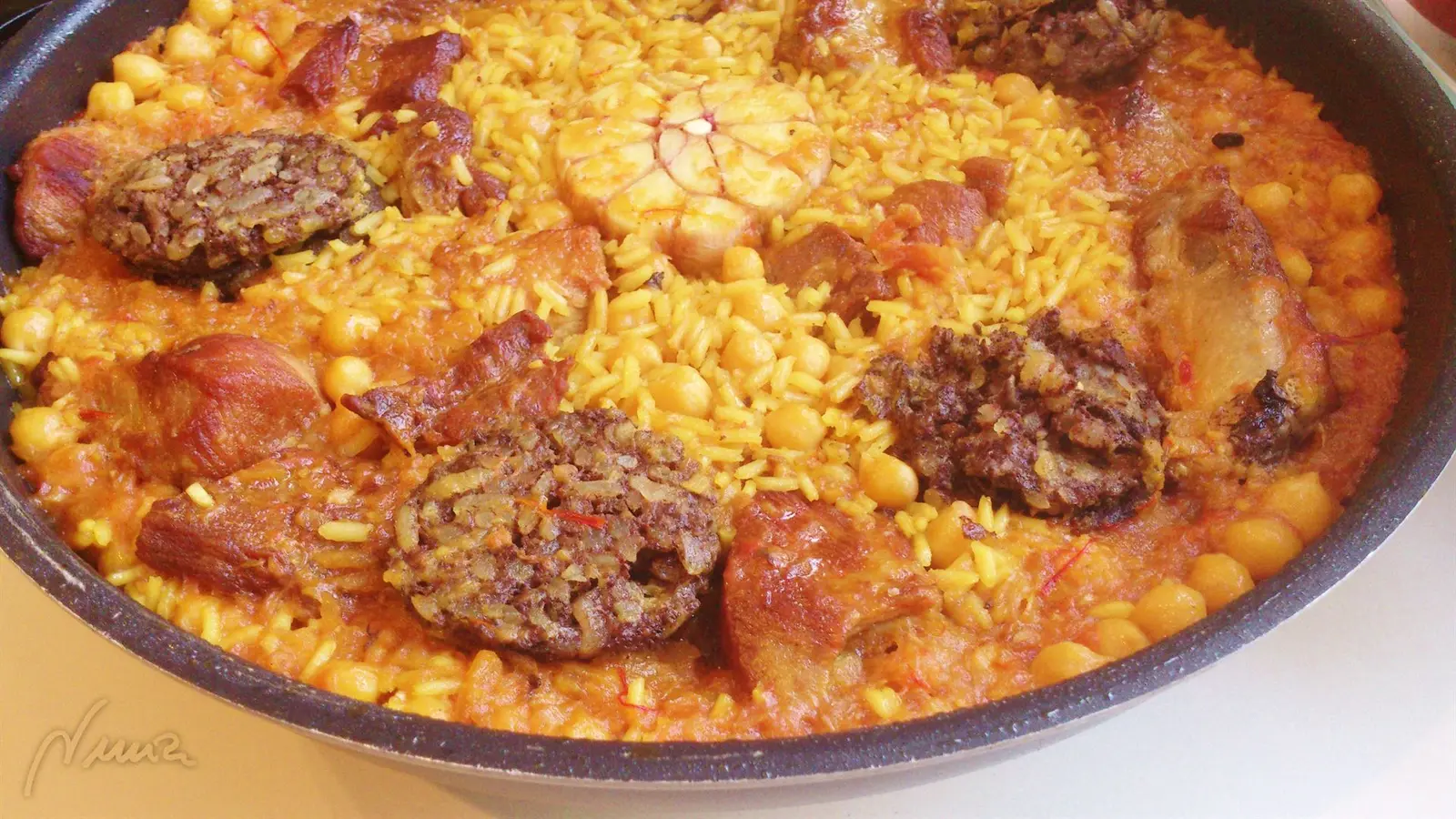 Arroz campero, paso 11: Cocer a fuego medio y destapado, durante 16-18 minutos, probar y si el arroz aún está…
