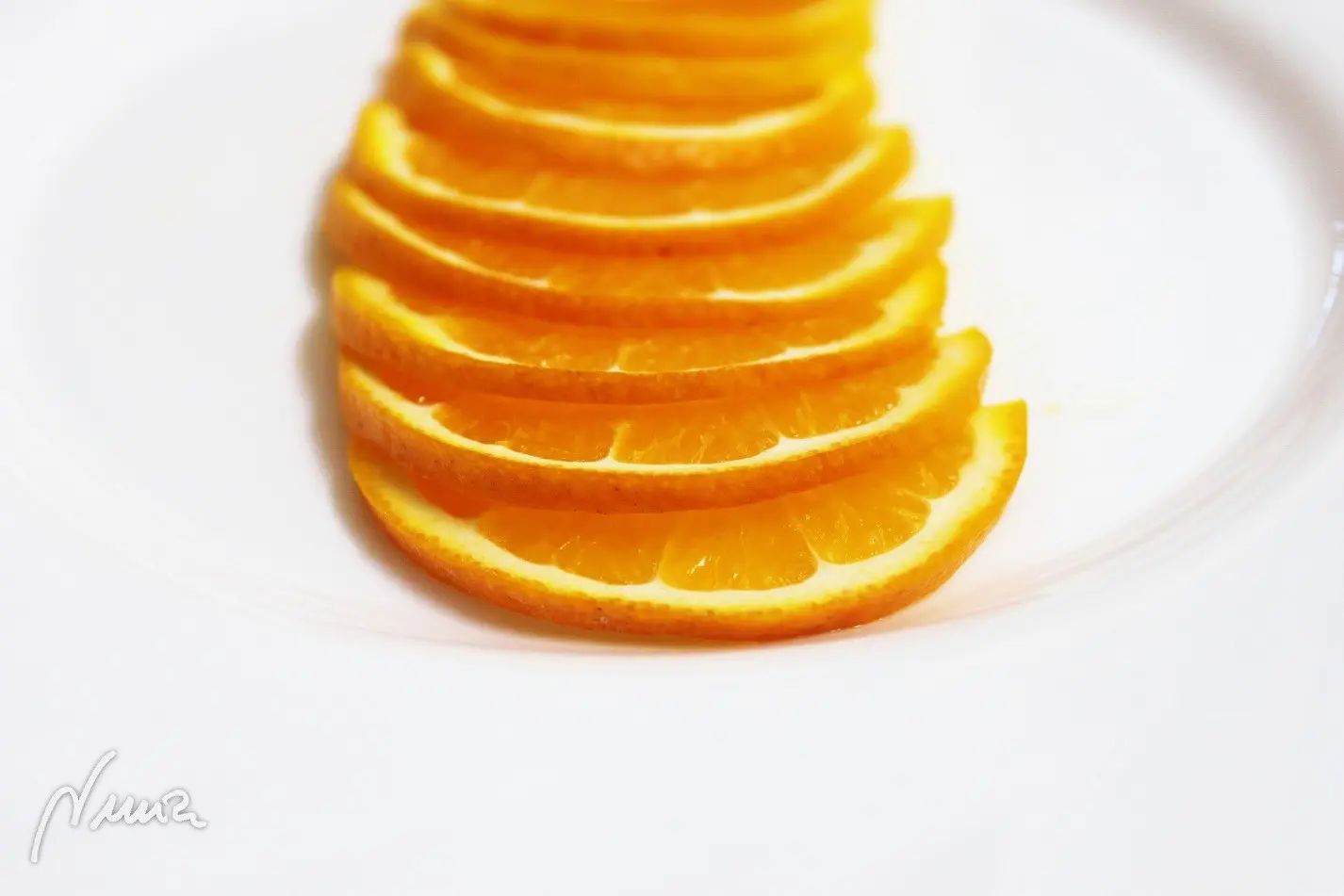 Naranja confitada, paso 2: Secar y cortar en rodajas muy finas, eliminando las semillas: