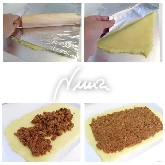 Rollo de patata con carne, paso 18: colocar encima una capa de la carne con tomate, dejando libre un margen de 2 centímetros…